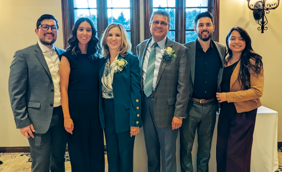Salazar is pictured with his wife, Esther, and two children, Melissa and Eric, with their spouses (Jose, far left, and Keren, far right), at his retirement party.