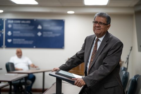Salazar is pictured during his last conference office worship with the staff.