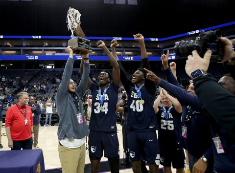 Photo: California Interscholastic Federation (CIF). Coach Piepoli raises the trophy after the team’s CIF Division III win.