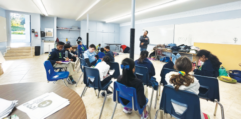 Camato leads the elementary Bible studies for about 20 students.