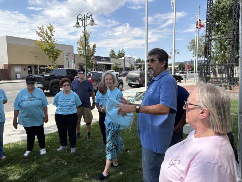 Gutierrez (second from right) speaks with volunteers from the church just before the event begins.